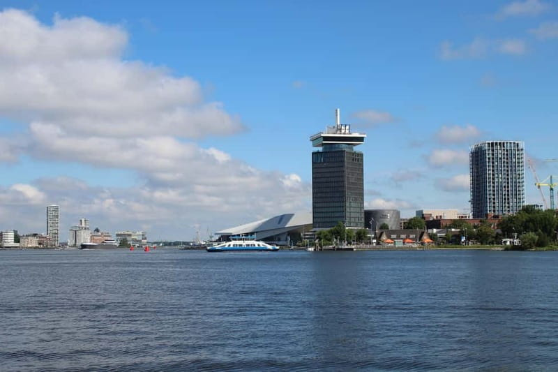 Amsterdam:: Bike Rental with Free Self-Guided Tour - Crossing The Ferry Into Rural Holland