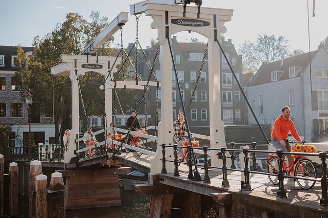 Amsterdam City Top Highlights Guided Bike Tour - Café streets, the oldest quarter, and the Red Light District