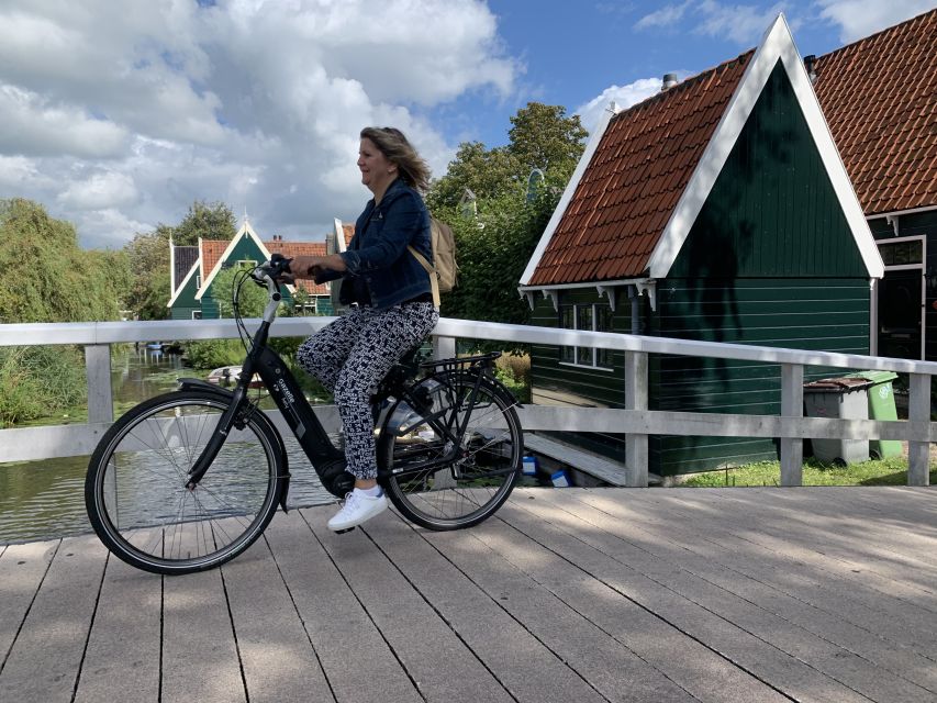 Amsterdam: Countryside Bike Tour and Zaanse Schans Windmills - Riding through wetlands painted by Monet