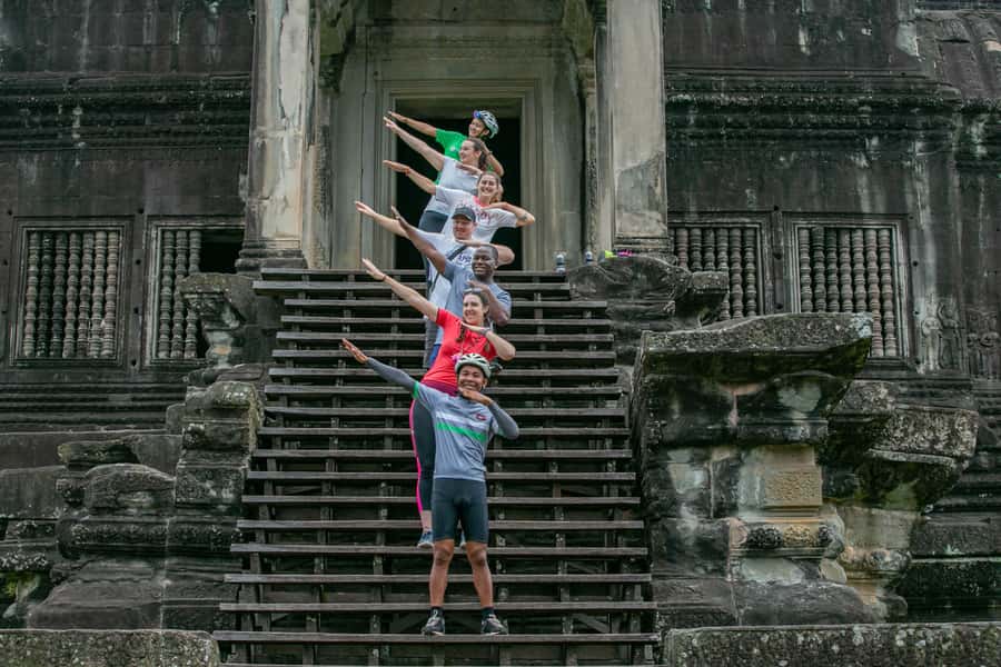 Angkor Wat: Guided Sunrise Bike Tour w/ Breakfast and Lunch - Riding behind Angkor Wat through village paths