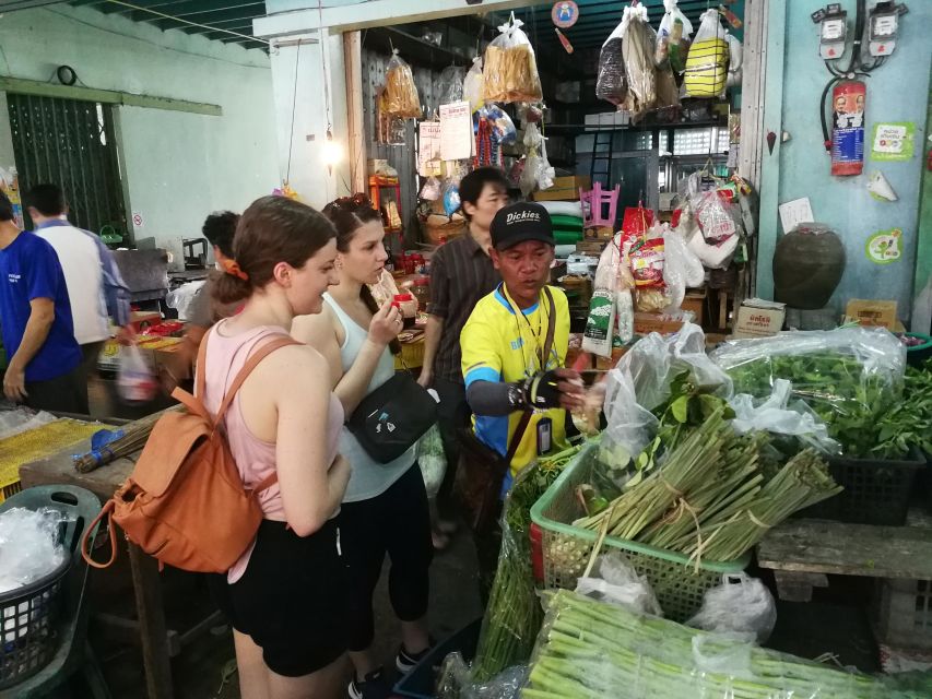 Bangkok: Bike and Canal Boat Tour with Lunch - Loading the bikes onto a long-tail boat