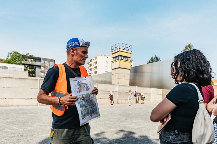 Berlin: Cold War & Berlin Wall History Guided Bike Tour - Checkpoint Charlie and the familiar symbols