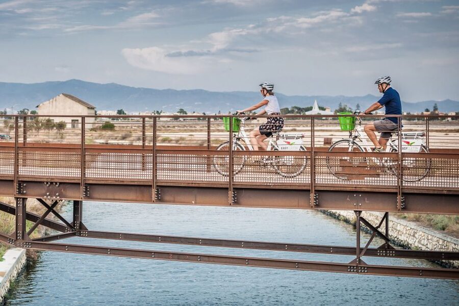 Cagliari E-Bike Tour: Canals & Flamingos at Molentargius - Crossing the lagoon toward Poetto Beach