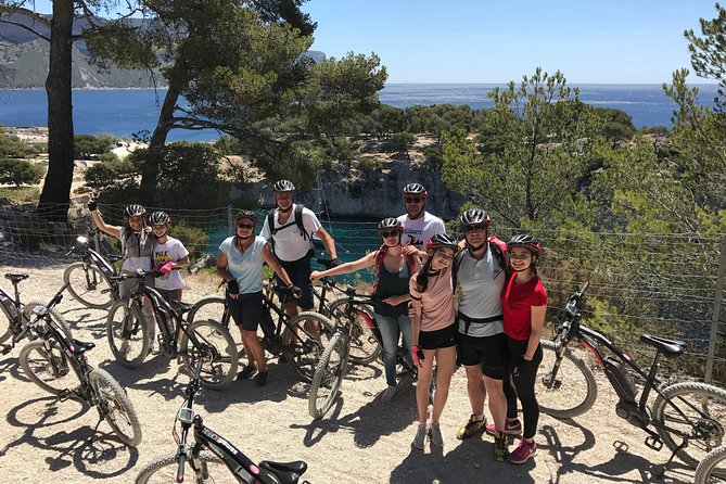 Cassis : Two Calanques Tour by Electric Mountain Bike - Port-Miou: boats, quarry stone, and a Provençal name