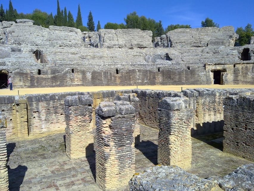 From Seville: Half-Day Guided Bike Trip to Italica - Crossing Seville by bike