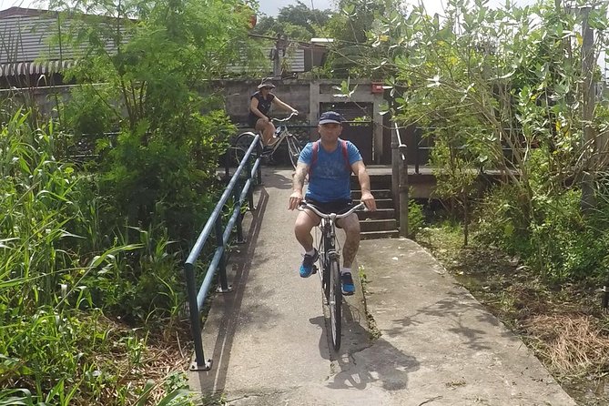 Half-Day Bangkok Bike Tour Including Lunch - Wat Tha Phra combines worship, age, and ordinary life