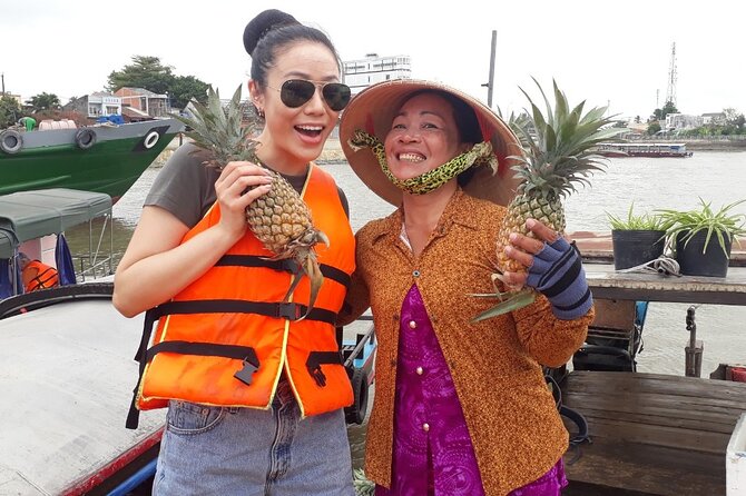 HCM: 2-Day Mekong Delta Floating Market with Cooking & Bike Ride - Coconut candy, fruit, honey tea, and folk music