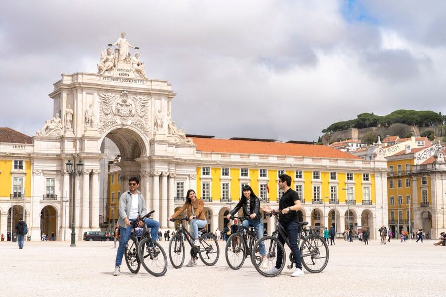 Lisbon: Guided Bike Tour, Helicopter Flight, and Boat Trip - Starting in Rossio Square with Lisbon underfoot