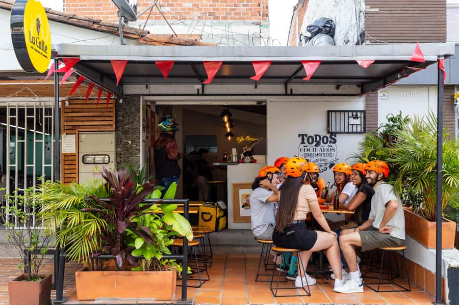 Medellín: E-bike and Foodie Tour - Parque Belén turns a snack stop into a city lesson