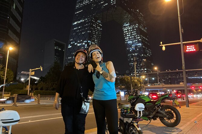 Modern Beijing Discovery by Bike - The Place and Beijing’s giant screen