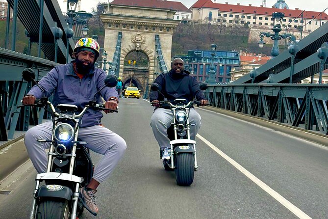 Monster Bike Sightseeing Tour – City Budapest on Electric Rollers - Shoes on the Danube Bank: a brief, serious stop