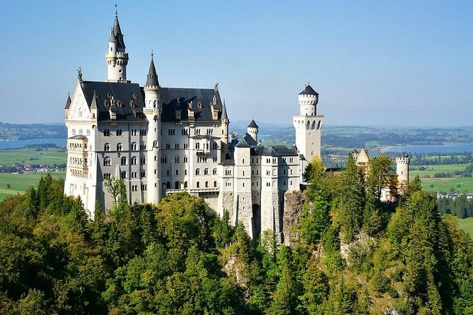 Neuschwanstein Castle by Bus Incl. Bike Ride or Hohenschwangau - Schwansee, swimming, and castle views