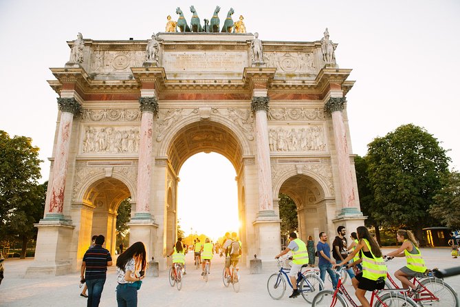 Paris Evening Snapshot Bike Tour - Riding past the Louvre and along the Seine