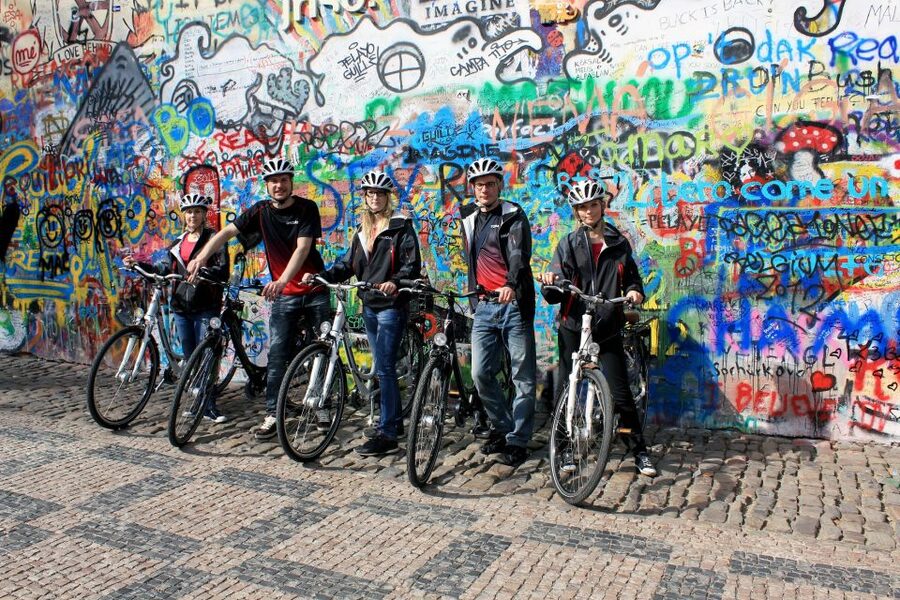 Prague: Bike or E-Bike City Tour with A Local Guide - Lennon Wall, the river, and the Dancing House