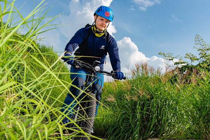 Private E-MTB guided cycling around Mt. Aso volcano & grasslands - Riding from the caldera floor toward Nakadake