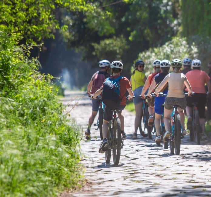 Rome: Appian Way & Aqueducts E-Bike Tour (Catacombs & Food) - Crossing Rome before reaching the ancient road