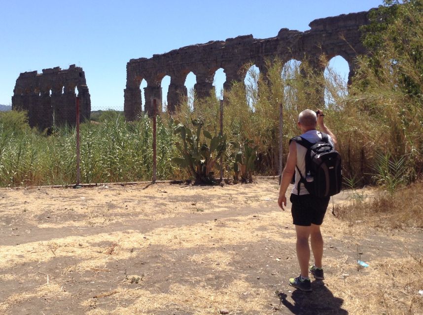 Rome: Appian Way E-Bike Tour Catacombs, Aqueducts & Picnic - Riding beneath the Aqueducts of Claudio and Felice