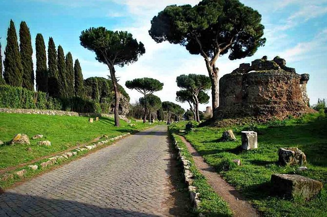 Rome: Appian Way E-bike Tour, Catacombs, Aqueducts & Transfer - Riding the Appian Way on rough Roman paving