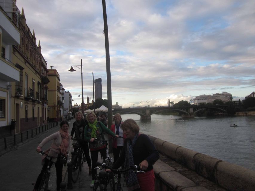 Seville: Highlights City Bike Tour - Triana brings pottery, tiles, and flamenco