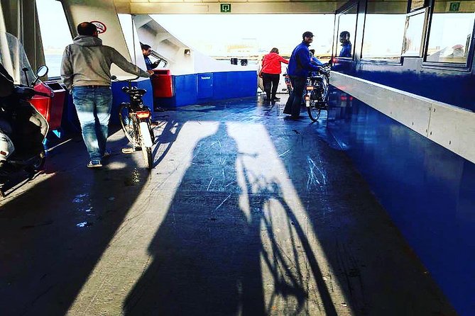 Urban Adventures Amsterdam Bike Tour, Graffiti and Magnet Fishing - The ferry to Amsterdam North