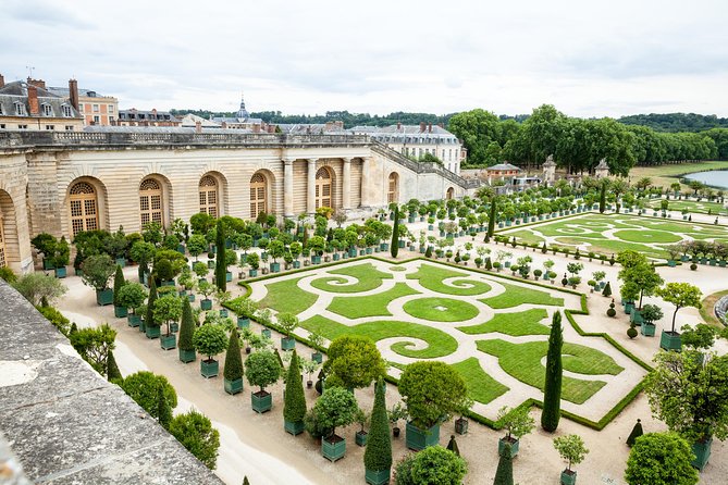 Versailles Full Day Bike Tour with Palace, Gardens, & Picnic - Riding through the royal gardens