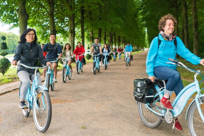 Versailles Palace Bike Tour with Market & Marie-Antoinette hamlet - Royal forests, the Apollo Fountain, and the long view